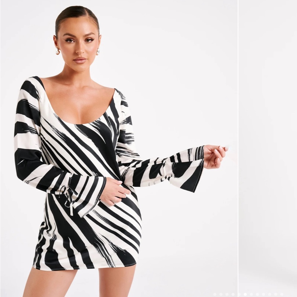 Brand new dress by MESHKI is a long-sleeved satin mini dress with low backing.